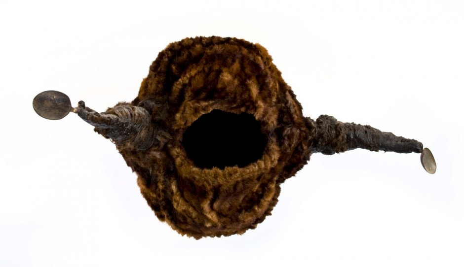 Cave (1992), size: 37 x 73 x 28cm. Fur, spoons, wax.