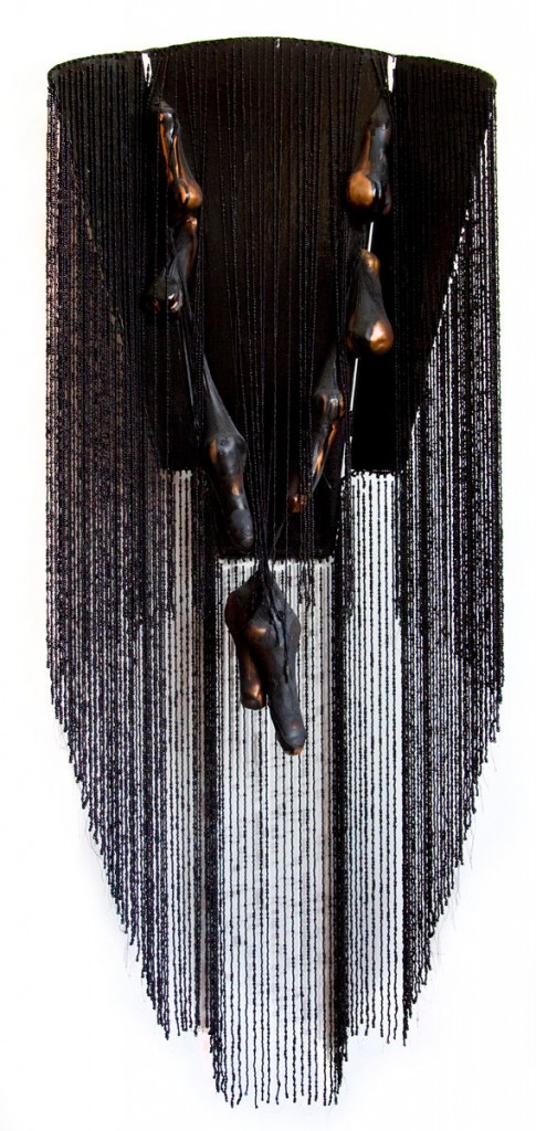Scrinium (2008), size: 140 x 55 x 24cm. Wood, beads, clay, panty.
