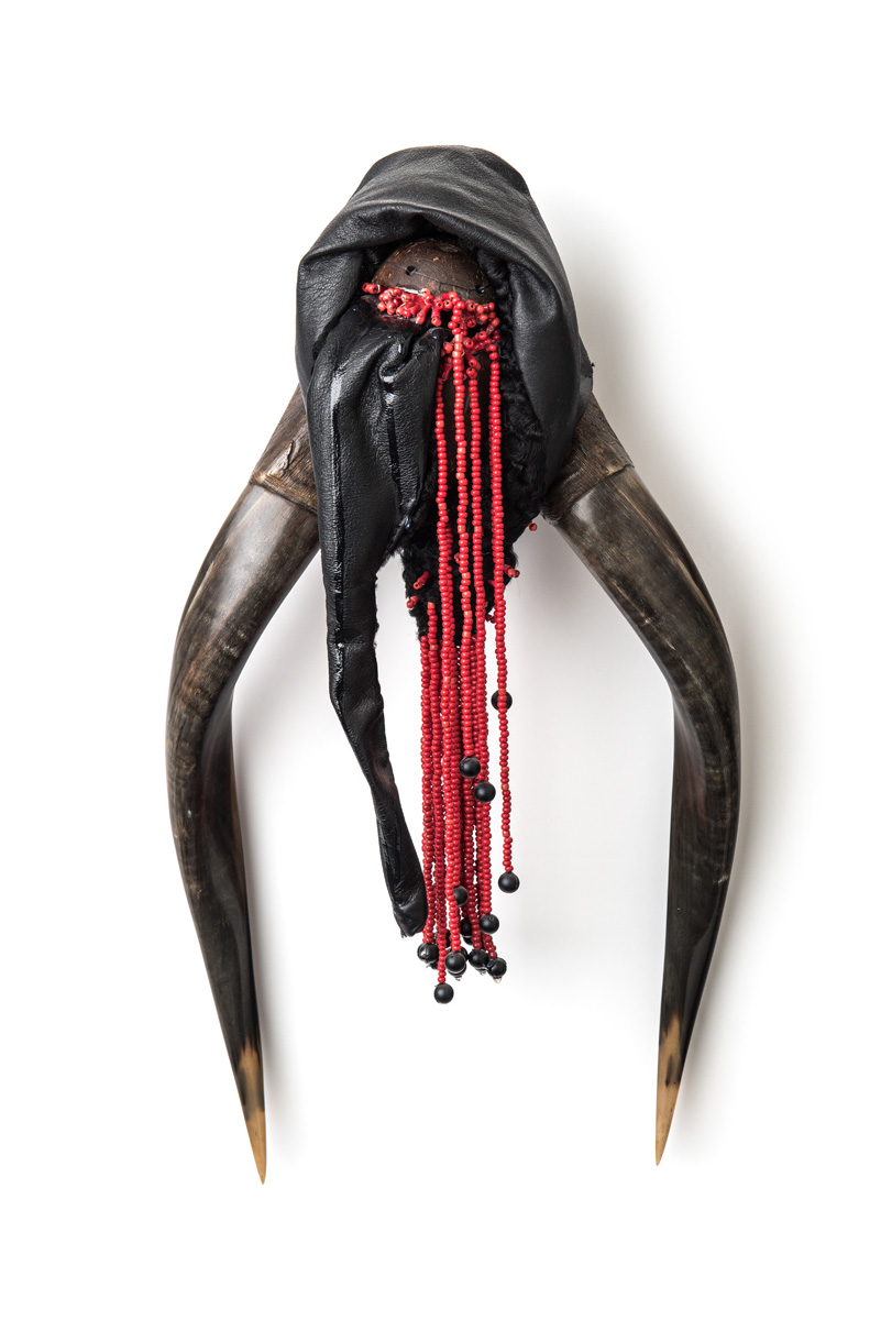 Kali (2018), 57x27x12cm. Antlers, fur, leather, beads, coconut, zipper.