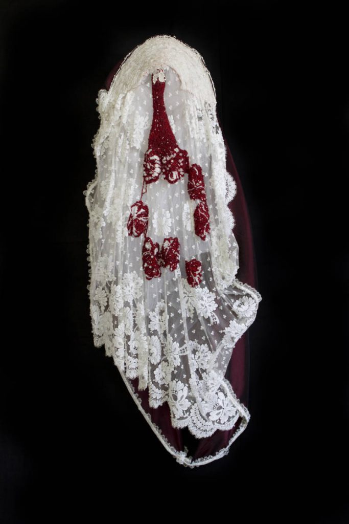 Catholic triptych 2: bride (2013), size: 120 x 4 x 21cm. Lace, textile, beads, metal.